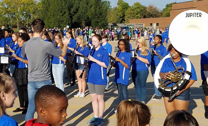 Marching Band students play for elementary students at Homecoming 2016 tailgate