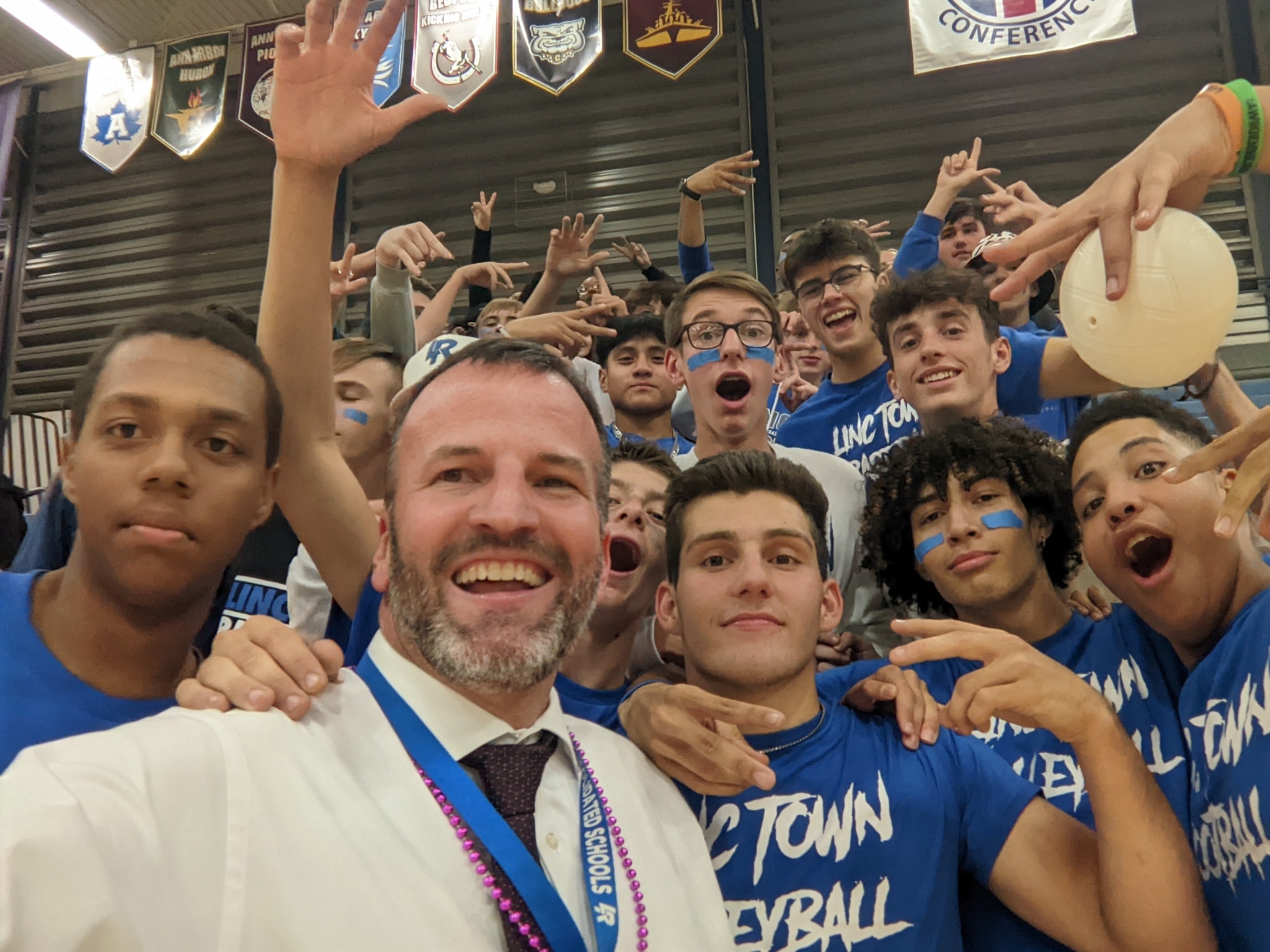 Mr. Jansen with students in the student section