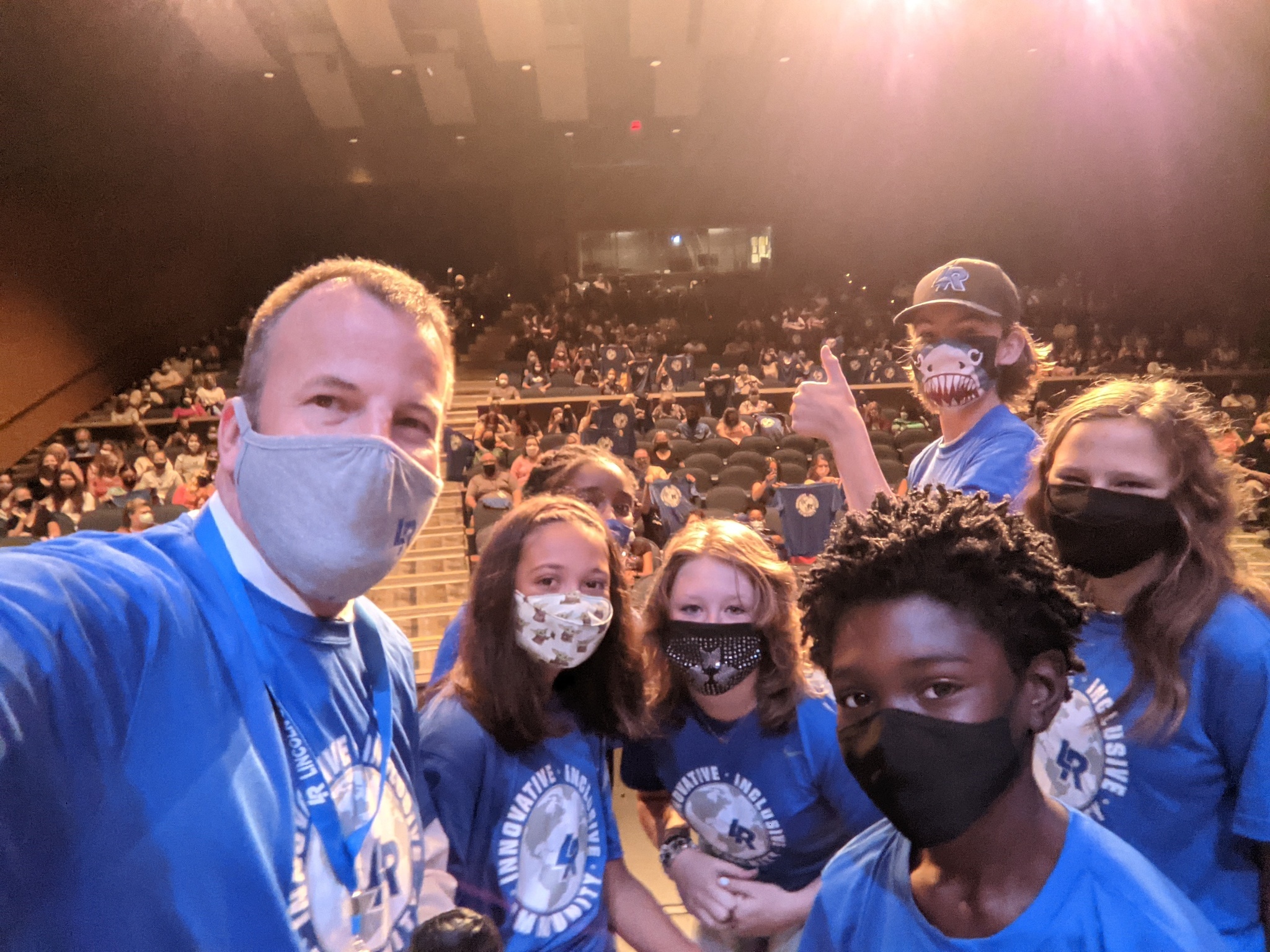 Superintendent Jansen posing with students